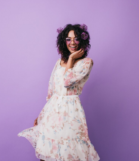 Editorial portrait in a white dress.
