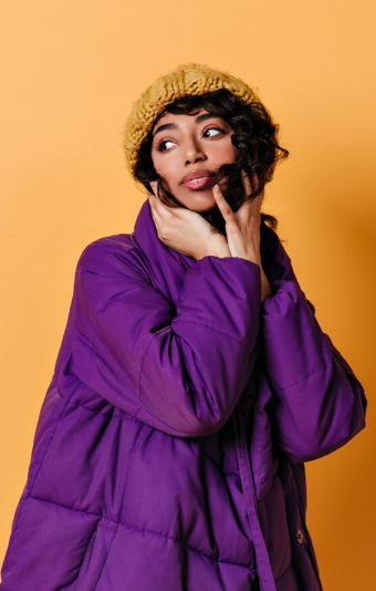 Editorial portrait in a black modest outfit.