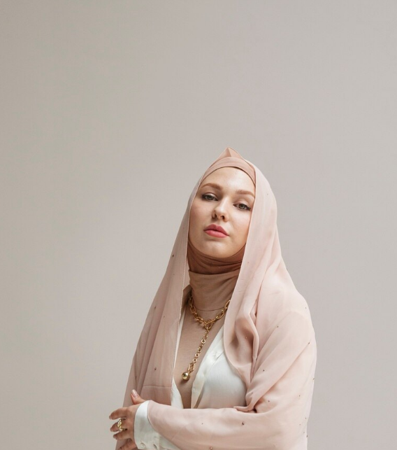 Editorial portrait in a satin hijab.