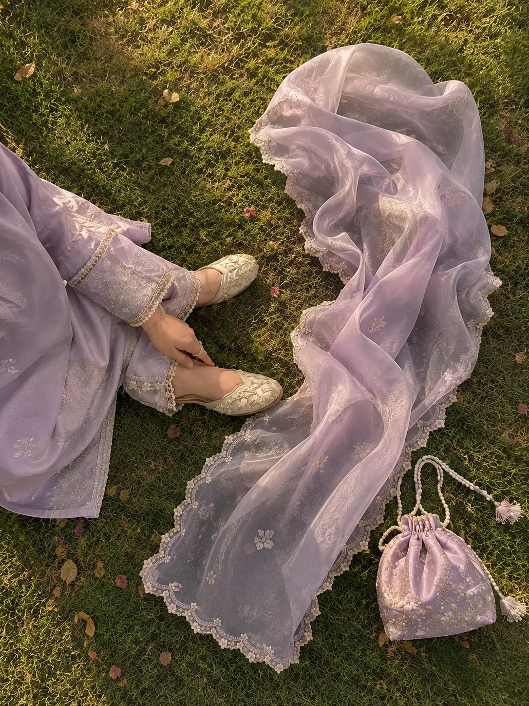 Sheer lilac organza dupatta spread across grass
